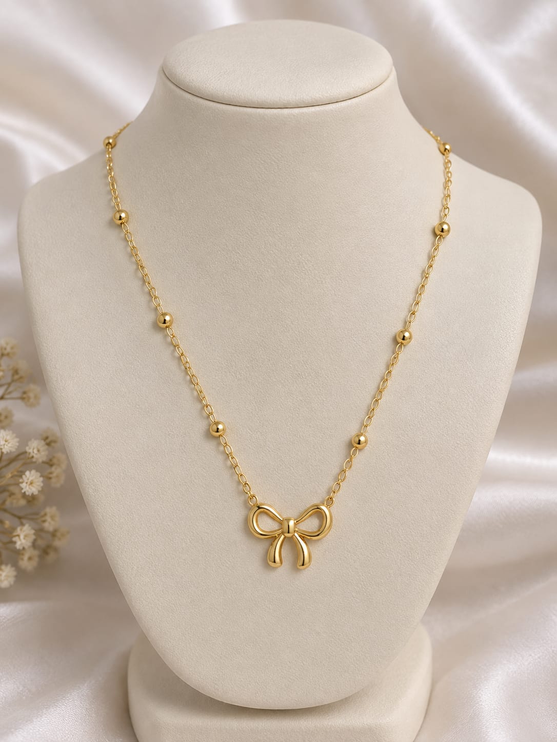 beaded bow necklace